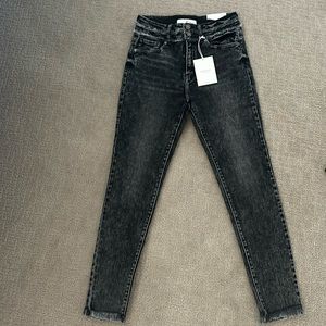 Size 5/26 KanCan High Rise Super Skinny faded black jeans with raw/frayed hem.